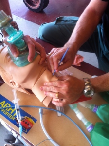 Our crew practicing a surgical airway on a task trainer